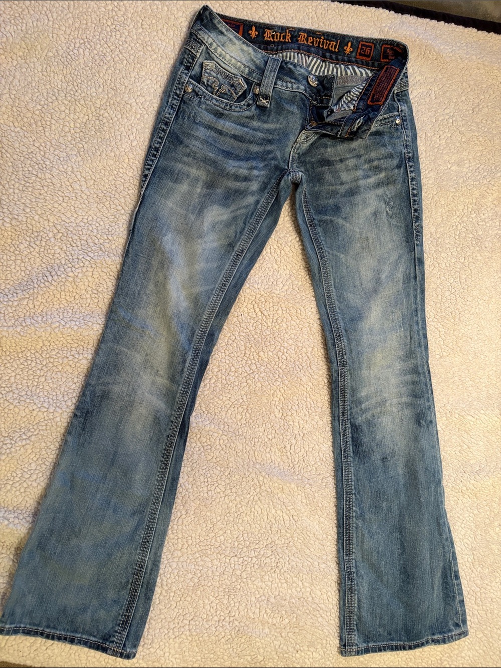 Rock Revival Light Blue Flare Jeans with Subtle Distressing